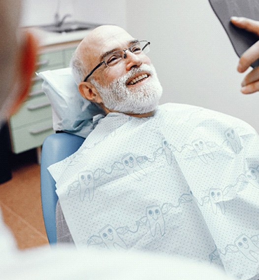 Man with implant dentures in Phoenix